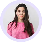 Circular team headshot of Sarah smiling with long dark hair in a pink sweater.