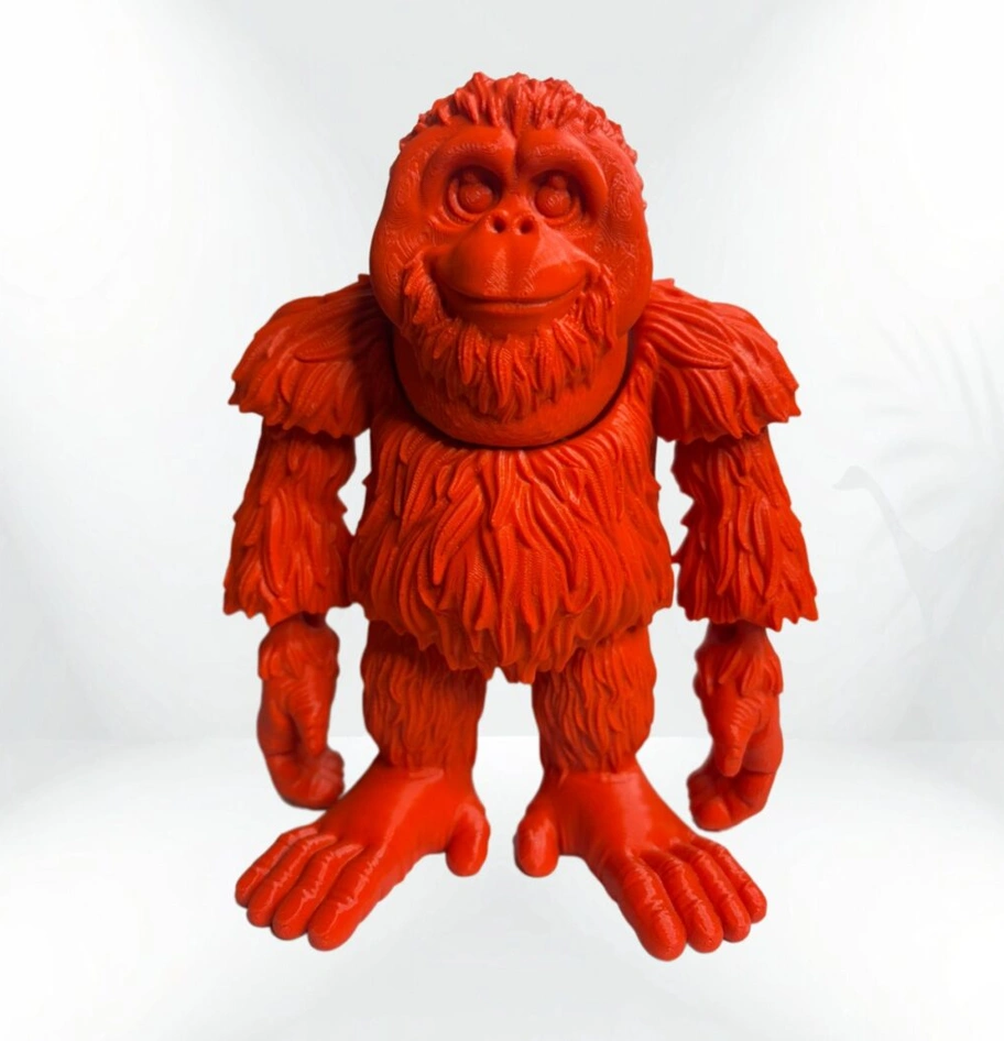 Red 3D printed stylized orangutan figure.