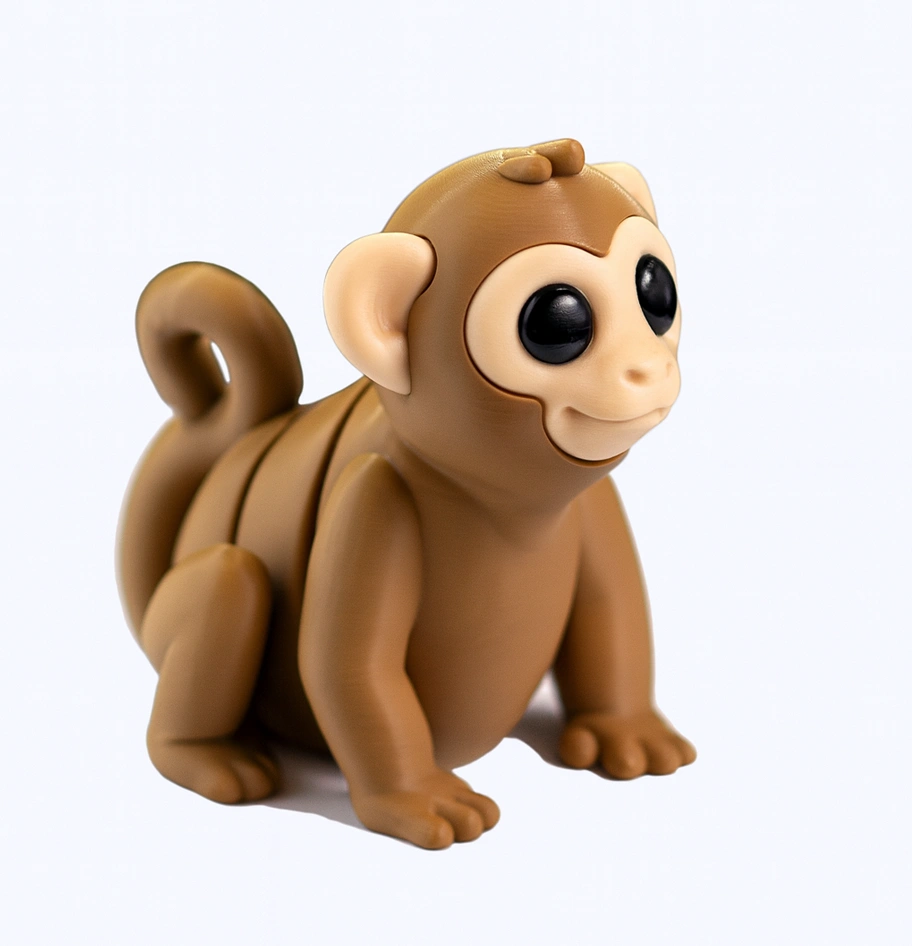 Stylized toy monkey figure on a white background.